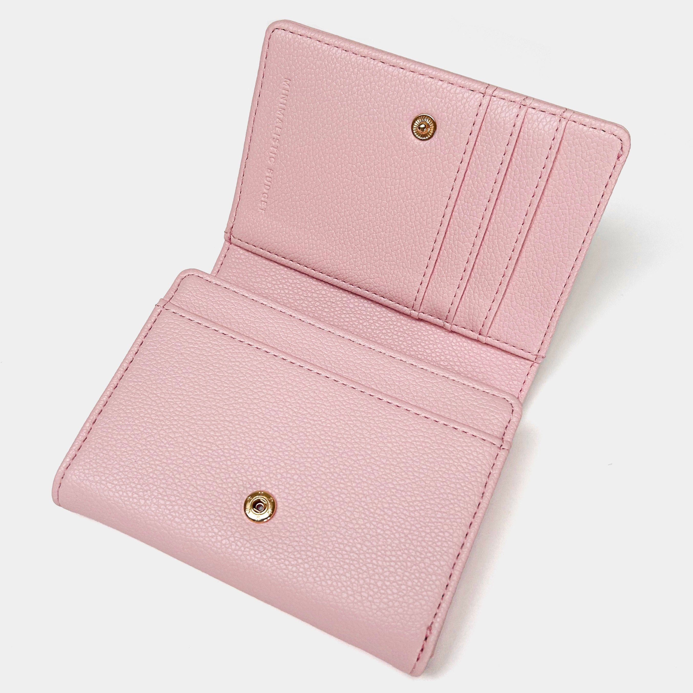 Pink wallet with gold accents on a light gray background