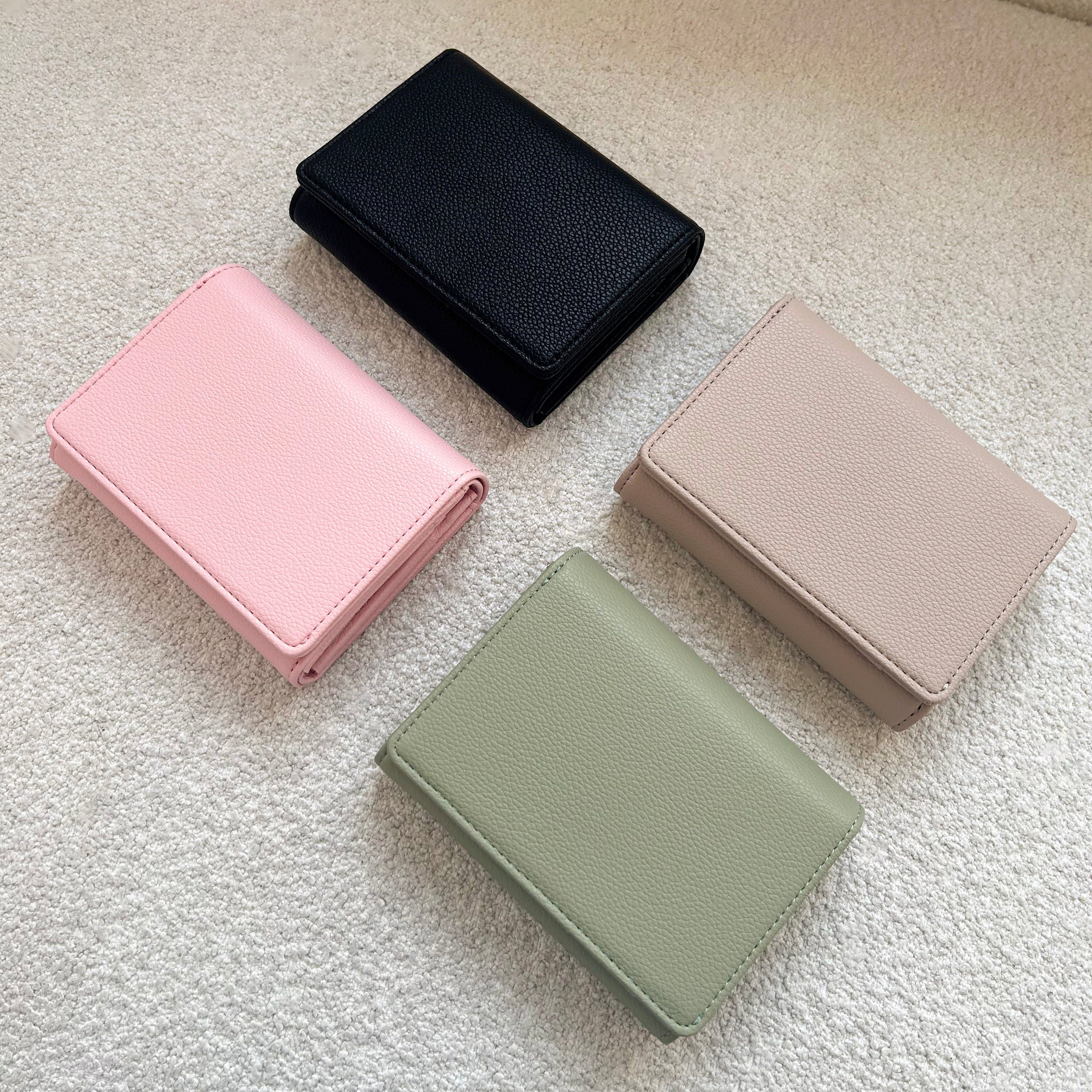 Black wallet, pink wallet, green wallet, beige wallet