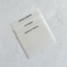 Three vellum cash envelopes with black ink labels