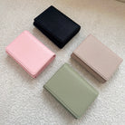 Black wallet, pink wallet, green wallet, beige wallet
