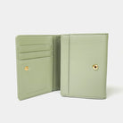 Green wallet open on a white background