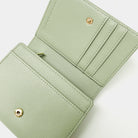 Green wallet with gold accents on a white background